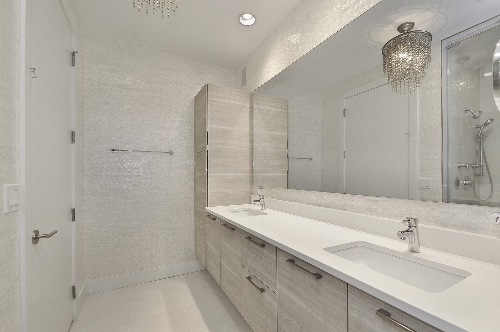 1124 West Adams Street, Unit PHW Chicago, IL 60607 - Photo 28 of 55 a bathroom with a sink double vanity and shower