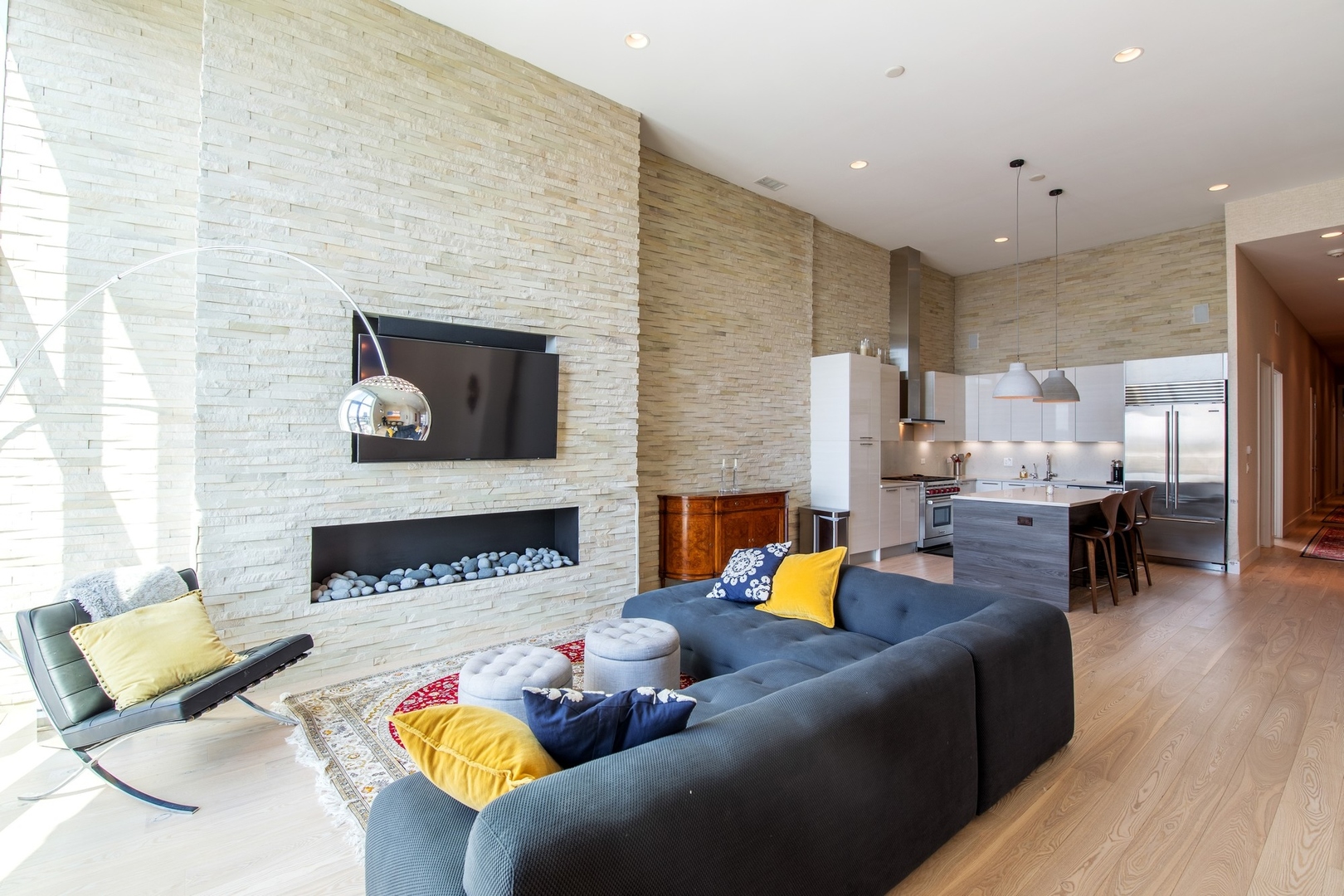 1124 West Adams Street, Unit PHW Chicago, IL 60607 - Photo 3 of 55 a living room with furniture and a fireplace