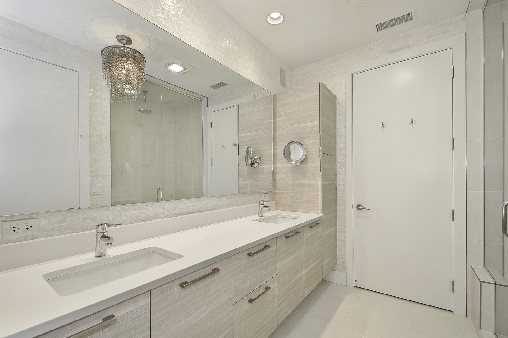 1124 West Adams Street, Unit PHW Chicago, IL 60607 - Photo 32 of 55 a bathroom with double vanity sink and a mirror