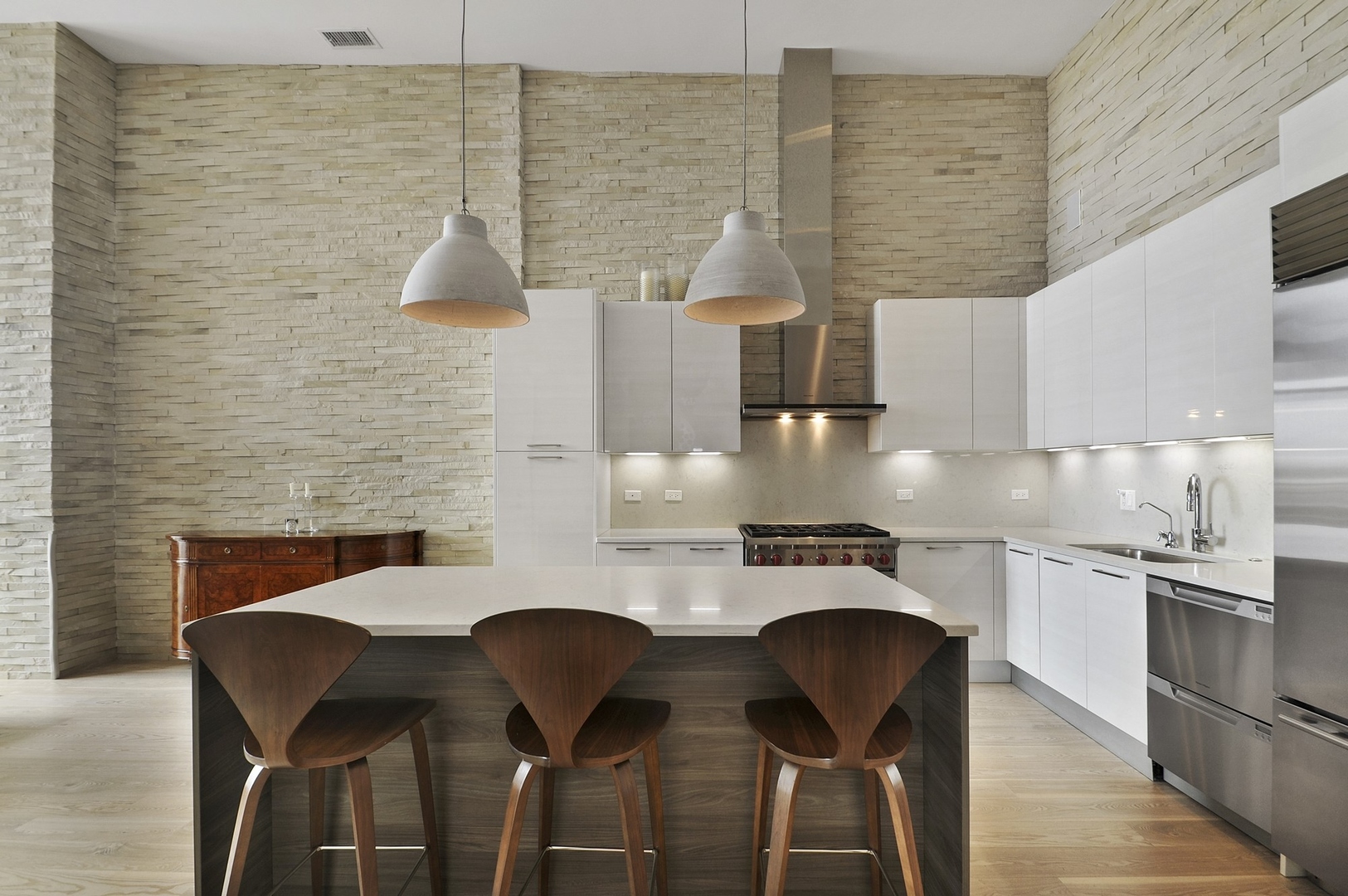 1124 West Adams Street, Unit PHW Chicago, IL 60607 - Photo 34 of 55 a kitchen with a table chairs and a stove