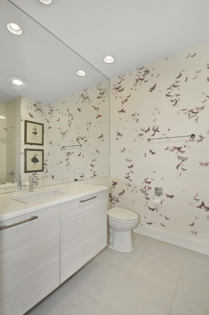 1124 West Adams Street, Unit PHW Chicago, IL 60607 - Photo 38 of 55 a bathroom with a sink toilet and shower