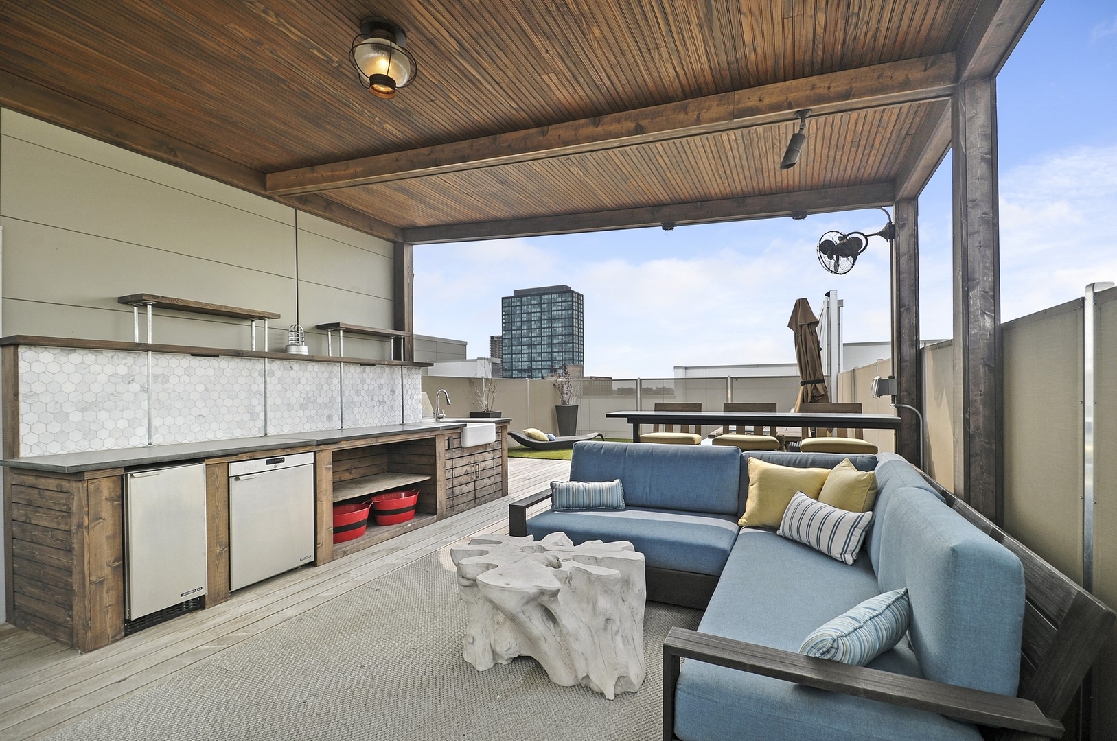 1124 West Adams Street, Unit PHW Chicago, IL 60607 - Photo 44 of 55 a living room with furniture a fireplace and a table