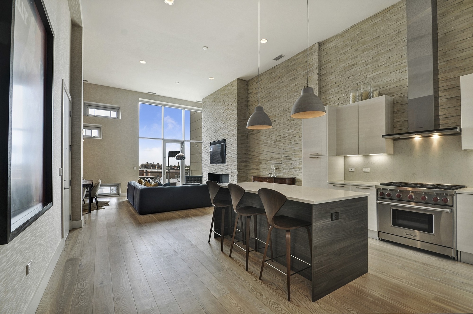 1124 West Adams Street, Unit PHW Chicago, IL 60607 - Photo 49 of 55 a kitchen with kitchen island a stove a counter top space and cabinets