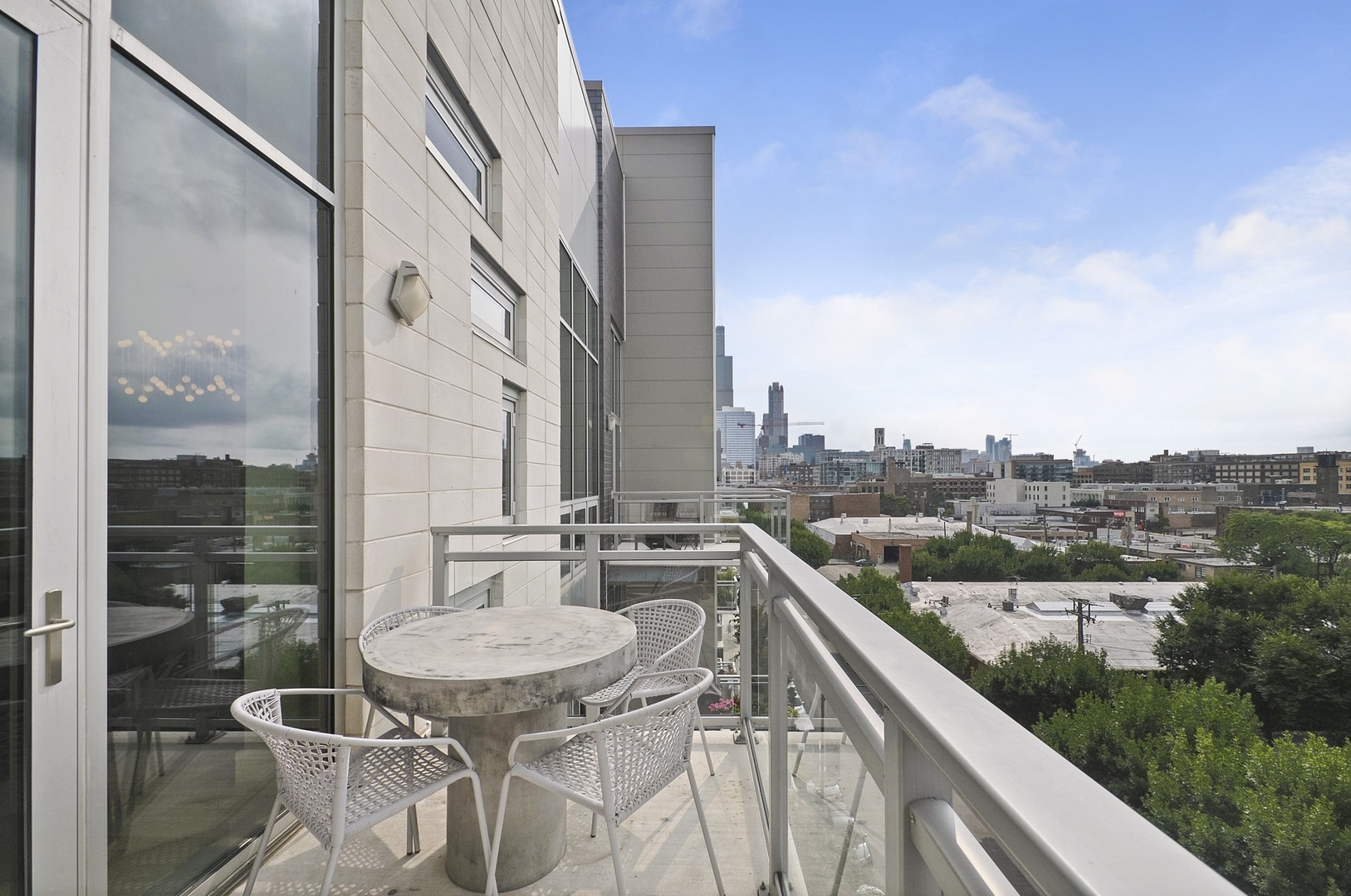 1124 West Adams Street, Unit PHW Chicago, IL 60607 - Photo 53 of 55 a balcony with table and chairs