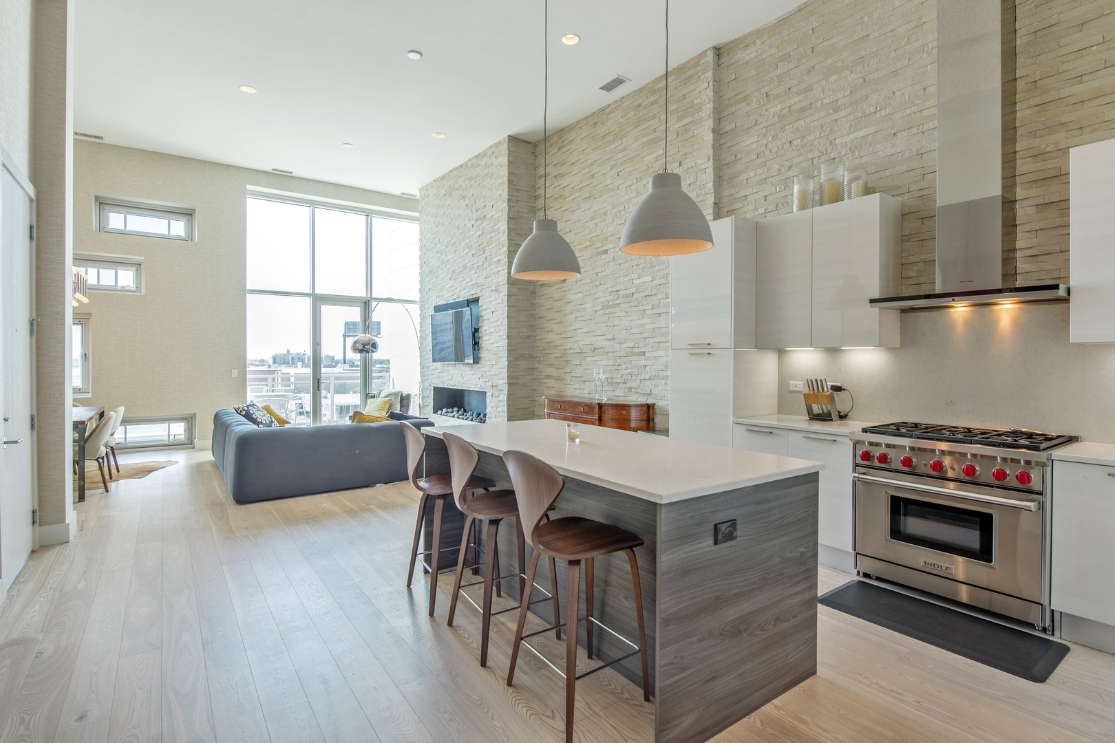1124 West Adams Street, Unit PHW Chicago, IL 60607 - Photo 8 of 55 a kitchen with a stove a refrigerator and wooden floor