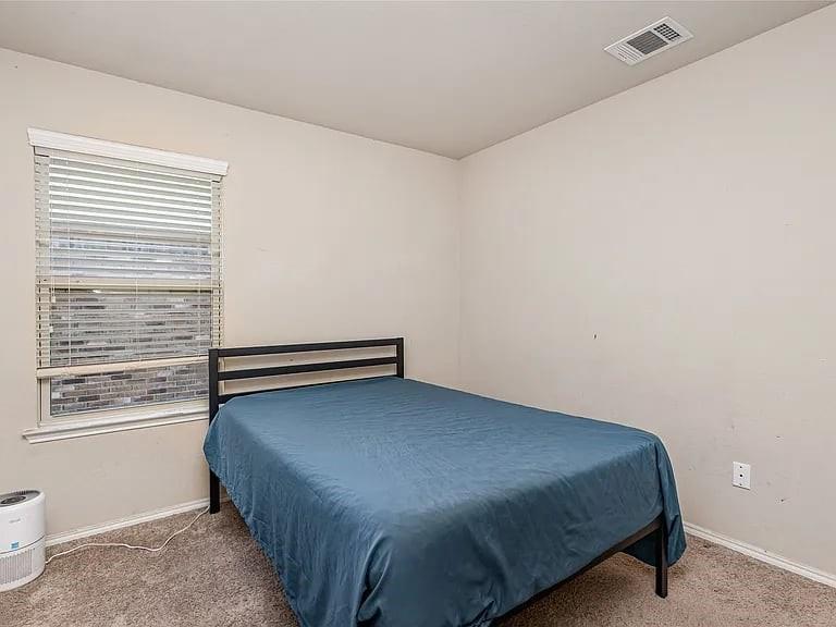 2320 Willard Way Forney, TX 75126 - Photo 18 of 26 a bedroom with a bed and window