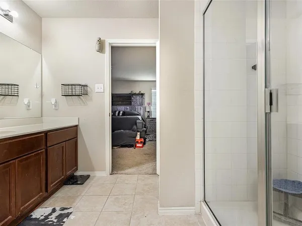 a en suite bathroom with a sink and a mirror