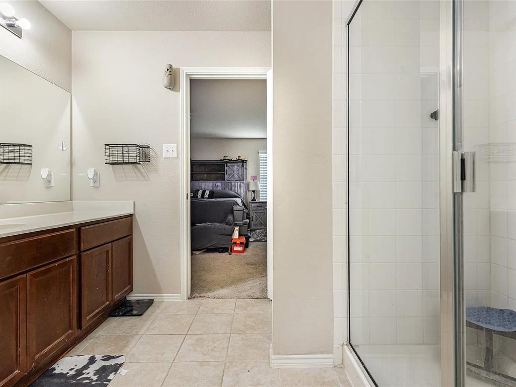 2320 Willard Way Forney, TX 75126 - Photo 20 of 26 a en suite bathroom with a sink and a mirror