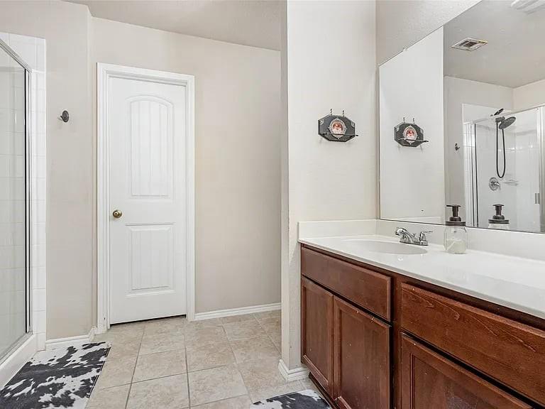 2320 Willard Way Forney, TX 75126 - Photo 21 of 26 a bathroom with a sink and a mirror