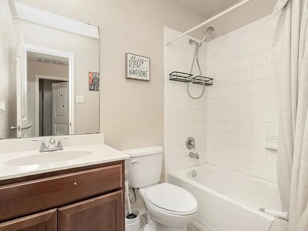 a bathroom with a sink a toilet and a bathtub