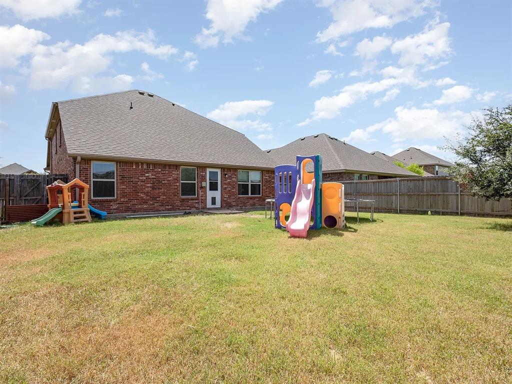 2320 Willard Way Forney, TX 75126 - Photo 26 of 26 a front view of a house with a yard and garage