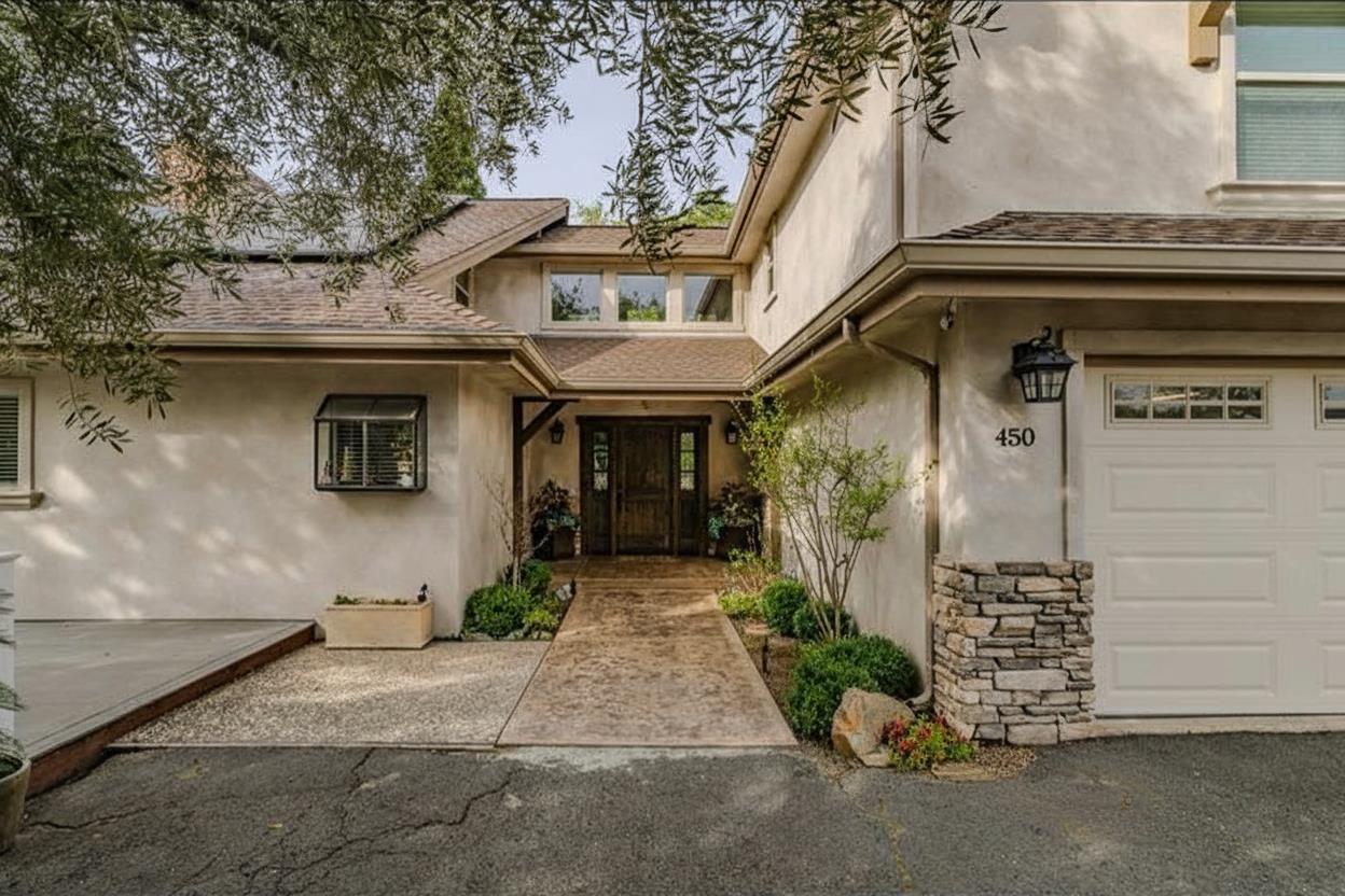 450 Lakeview Road Copperopolis, CA 95228 - Photo 14 of 93 a front view of a house with a garden