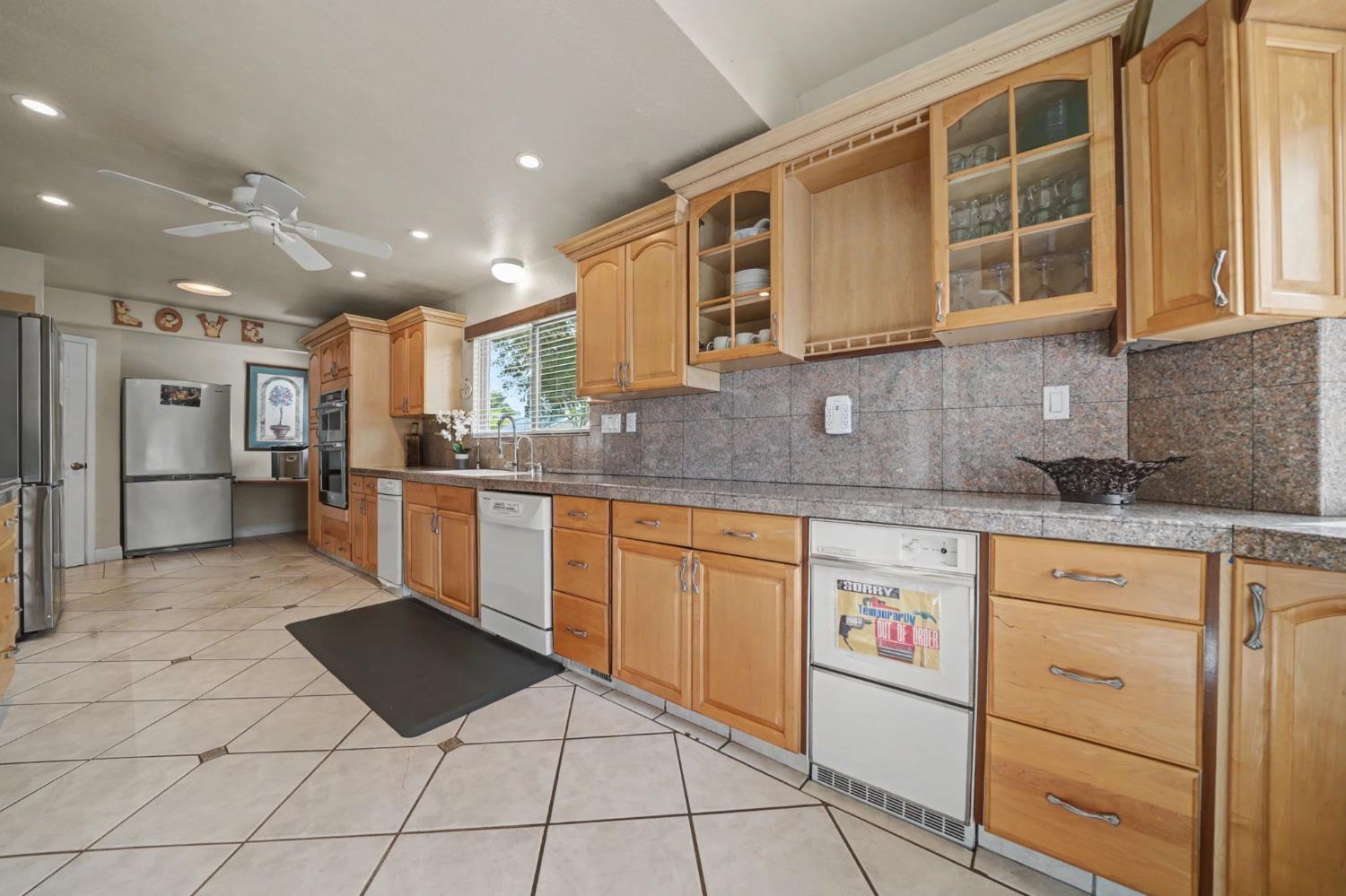 450 Lakeview Road Copperopolis, CA 95228 - Photo 25 of 93 a kitchen with stainless steel appliances granite countertop a stove and a sink