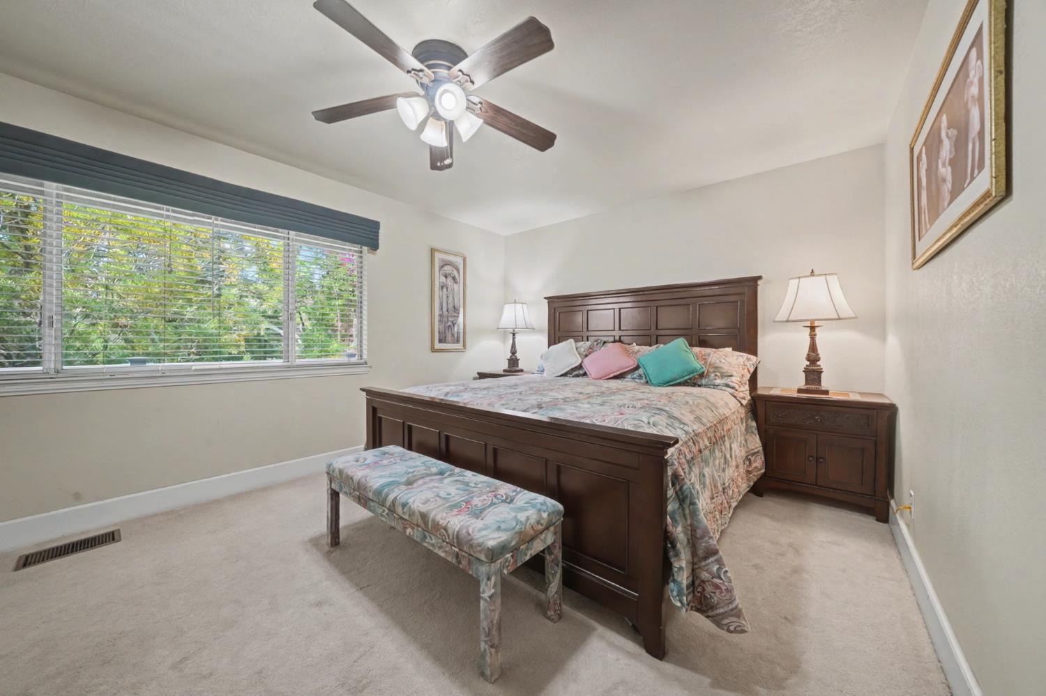 450 Lakeview Road Copperopolis, CA 95228 - Photo 38 of 93 a bedroom with a bed and a chandelier