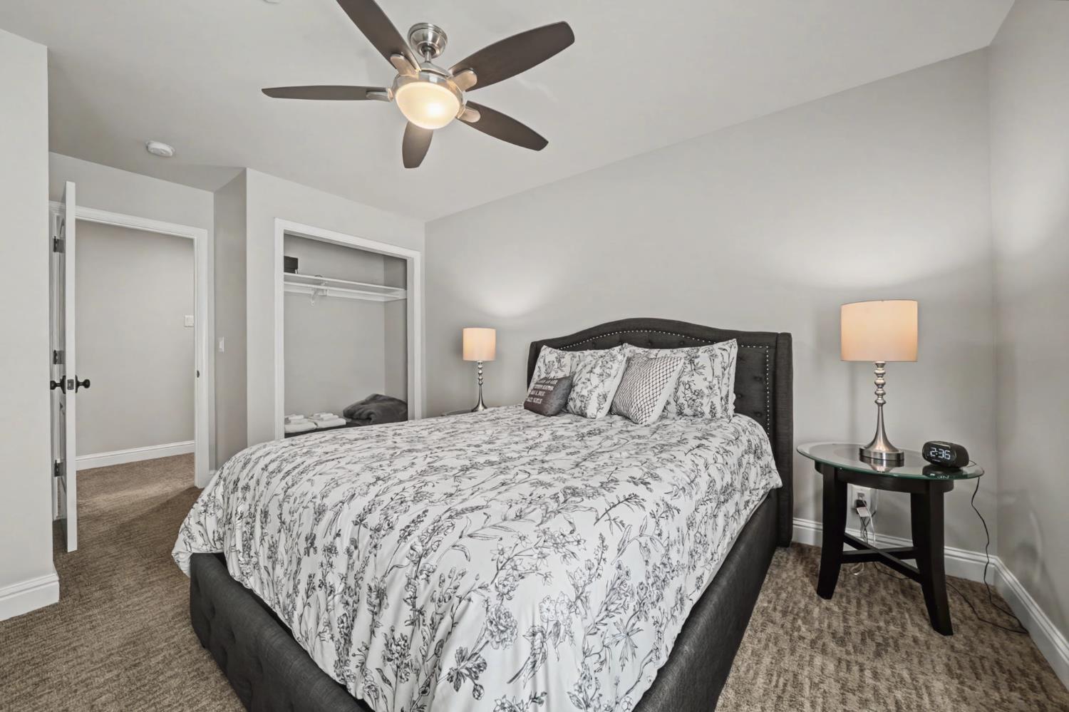 450 Lakeview Road Copperopolis, CA 95228 - Photo 54 of 93 a bedroom with a bed and a lamp