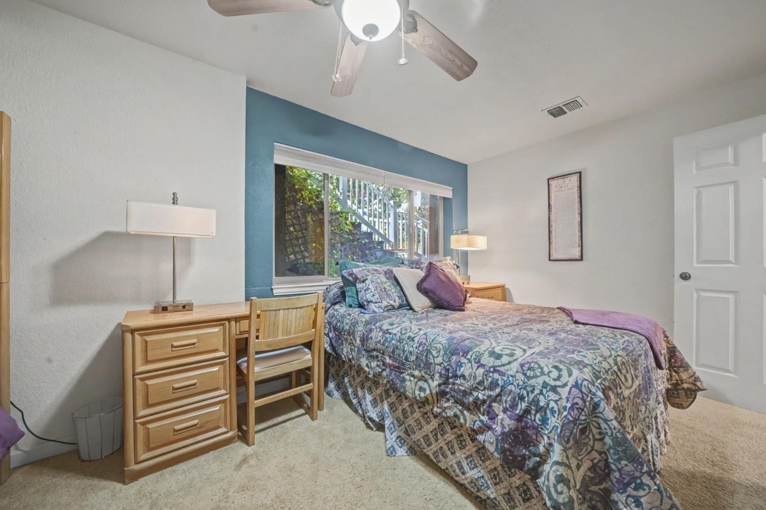 450 Lakeview Road Copperopolis, CA 95228 - Photo 72 of 93 a bedroom with a bed and a night stand