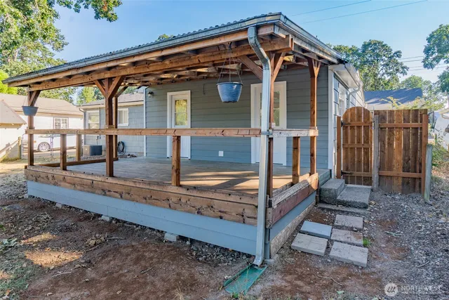 a view of backyard with small cabin