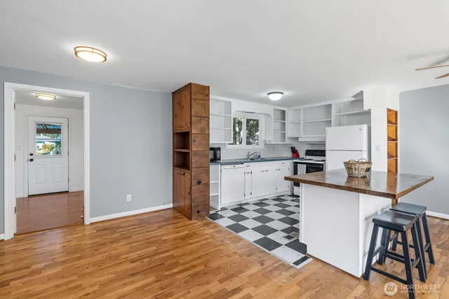 a kitchen with stainless steel appliances granite countertop a refrigerator sink and cabinets