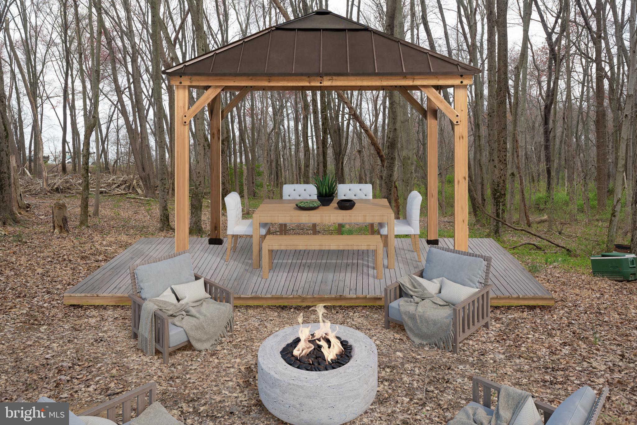 19601 Darnestown Road Beallsville, MD 20839 - Photo 48 of 119 a view of a patio with couches table and chairs under an umbrella
