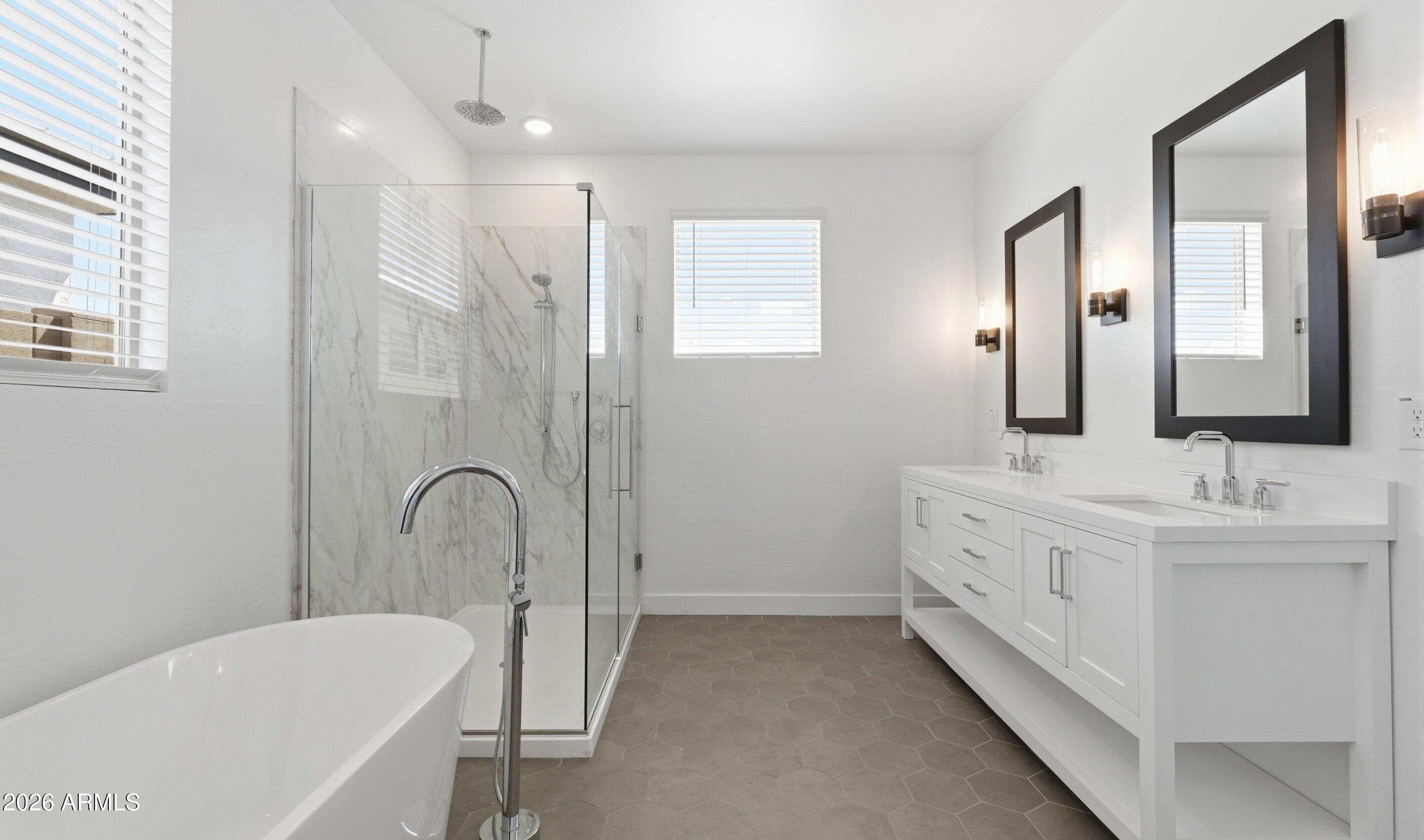 7779 West Sands Road Glendale, AZ 85303 - Photo 26 of 37 a bathroom with a double vanity sink mirror and bathtub