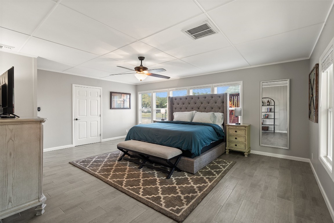 35 Presidio Road Wimberley, TX 78676 - Photo 20 of 39 a bedroom with a bed window and a flat screen tv