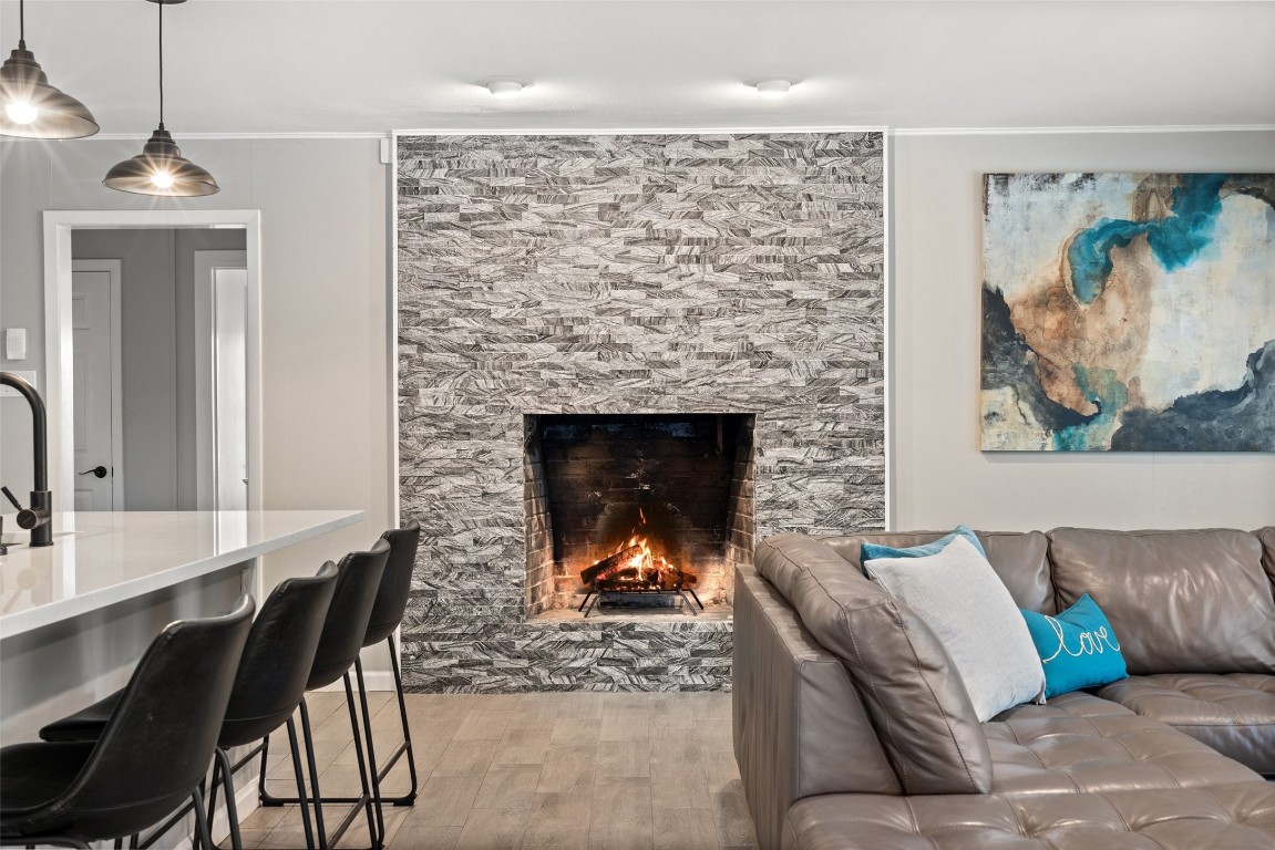 35 Presidio Road Wimberley, TX 78676 - Photo 2 of 39 a living room with furniture and a fireplace
