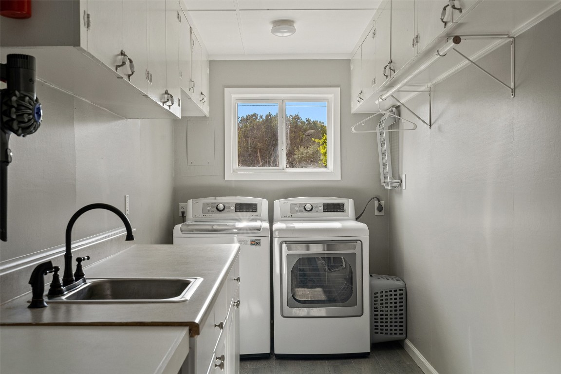 35 Presidio Road Wimberley, TX 78676 - Photo 29 of 39 a view of a sink and washer and dryer