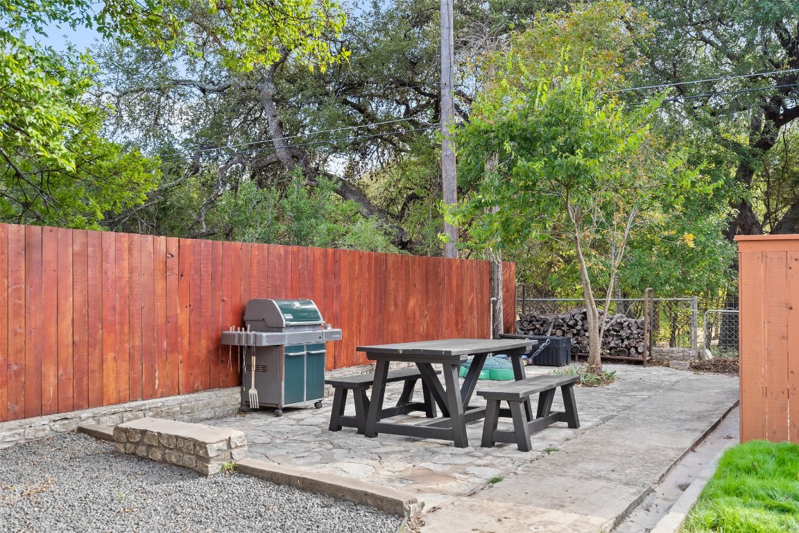 35 Presidio Road Wimberley, TX 78676 - Photo 9 of 39 an outdoor space with furniture and umbrella