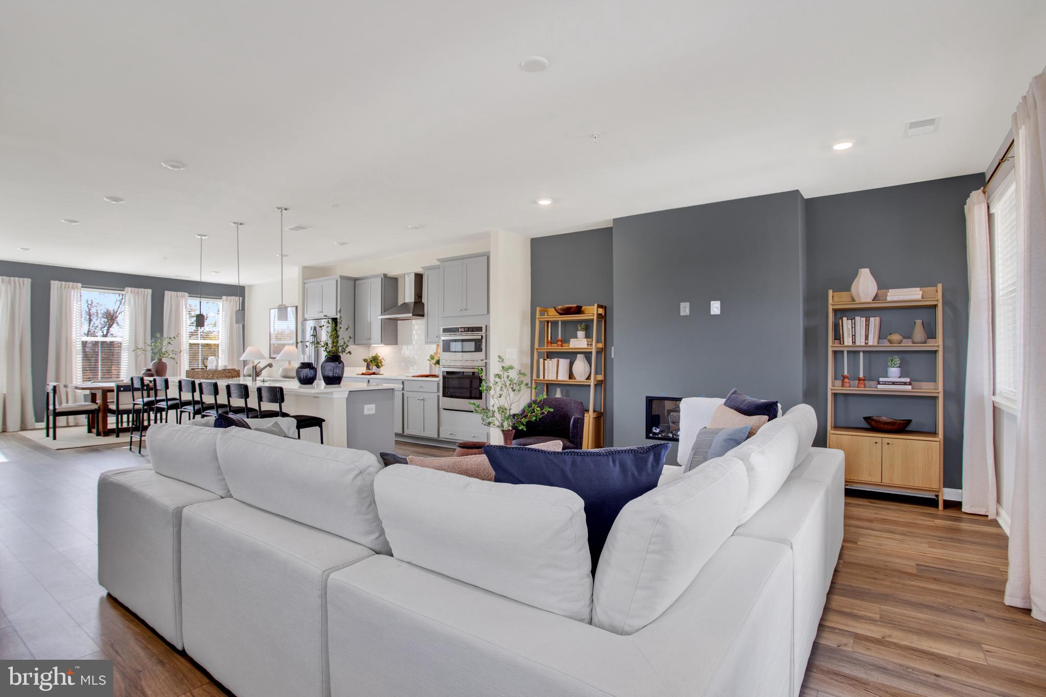 1006 Swallowtail Lane Manassas, VA 20110 - Photo 11 of 65 a living room with furniture and a wooden floor