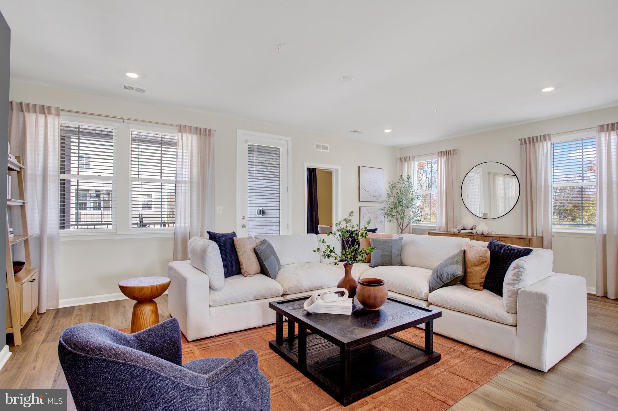 1006 Swallowtail Lane Manassas, VA 20110 - Photo 13 of 65 a living room with furniture and a large window