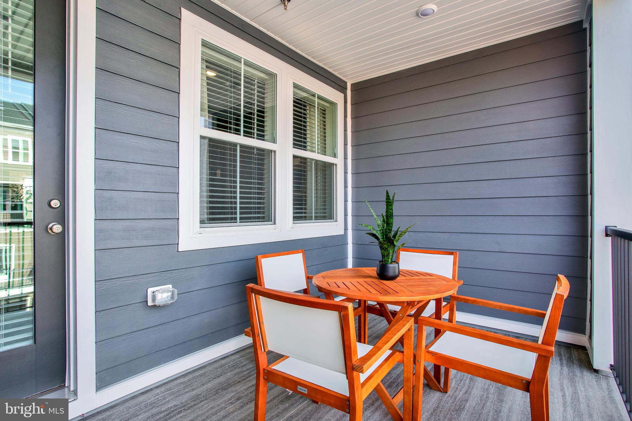 1006 Swallowtail Lane Manassas, VA 20110 - Photo 15 of 65 a view of a outdoor seating area with wooden floor