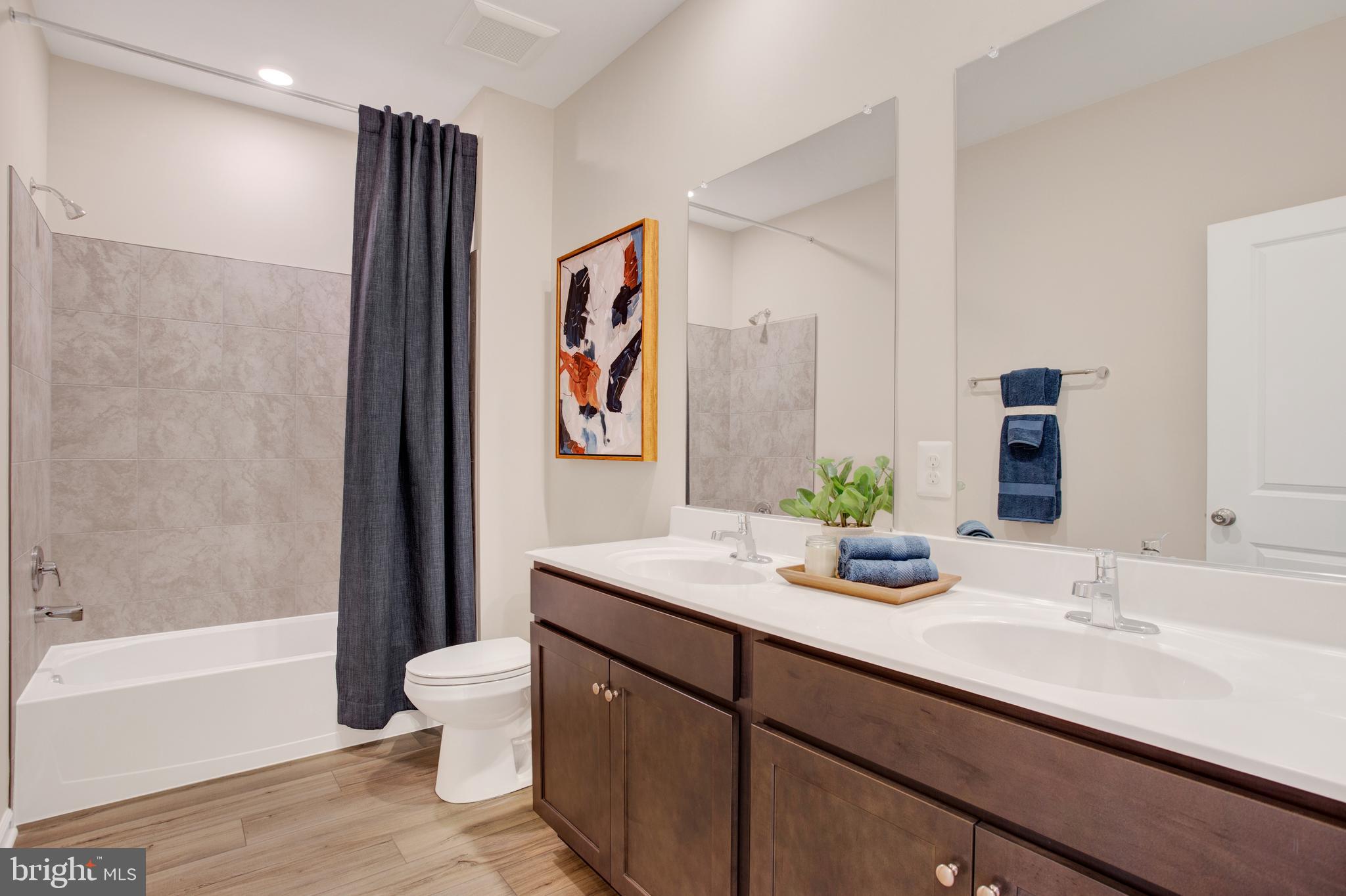 1006 Swallowtail Lane Manassas, VA 20110 - Photo 23 of 65 a bathroom with a double vanity sink toilet and bathtub
