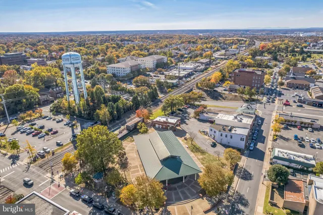 an aerial view of residential houses with city view