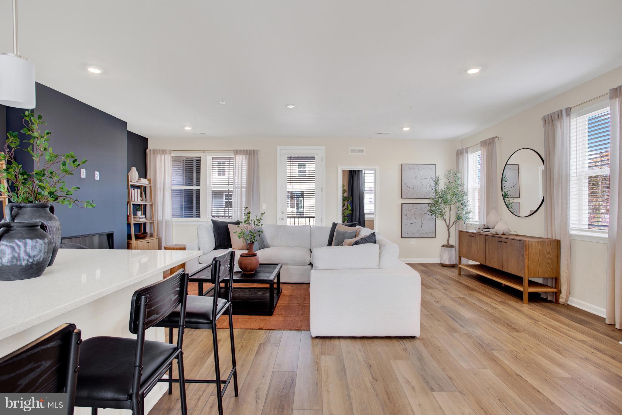 1006 Swallowtail Lane Manassas, VA 20110 - Photo 9 of 65 a living room with furniture a large window and wooden floor