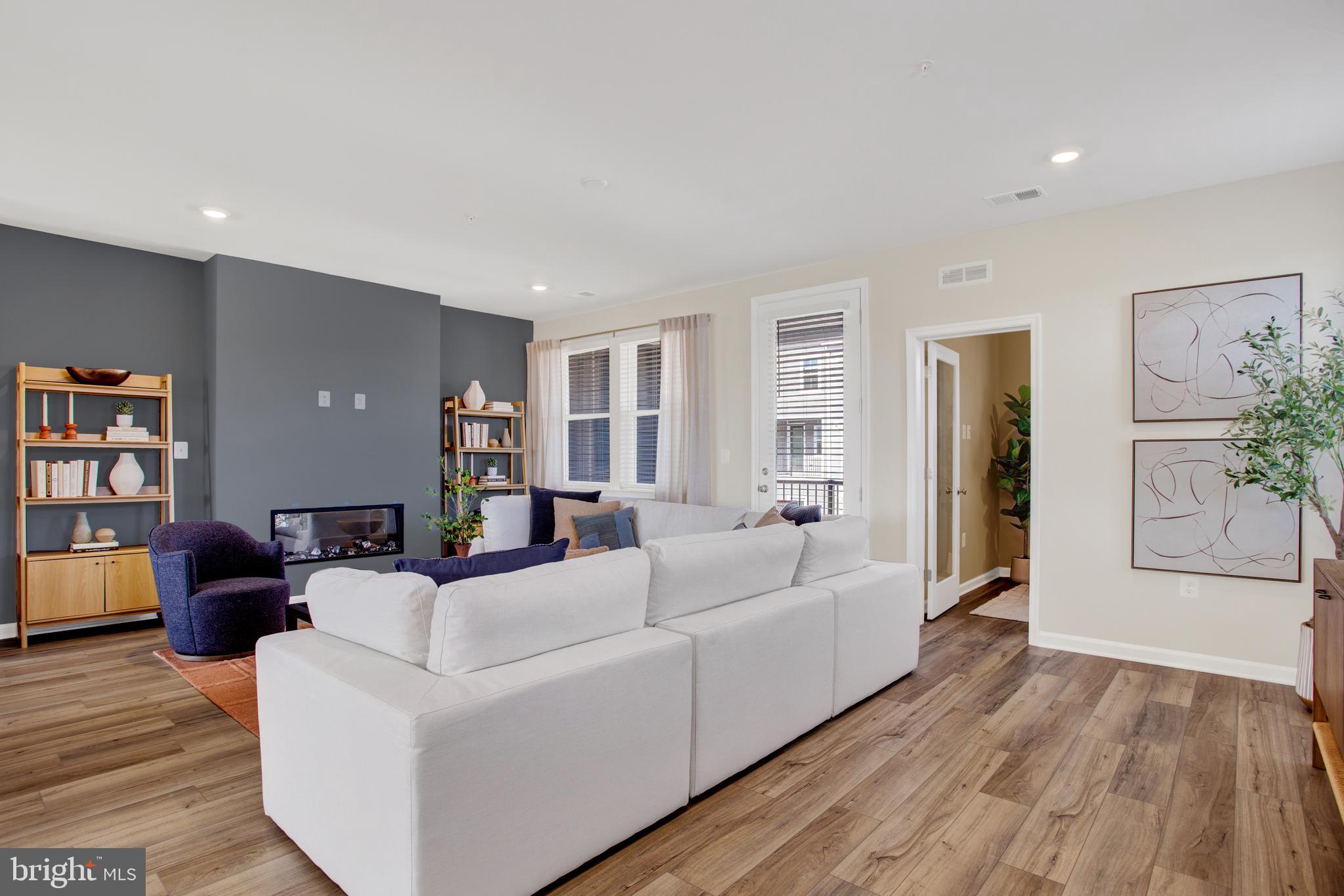 1006 Swallowtail Lane Manassas, VA 20110 - Photo 10 of 65 a living room with furniture and a wooden floor