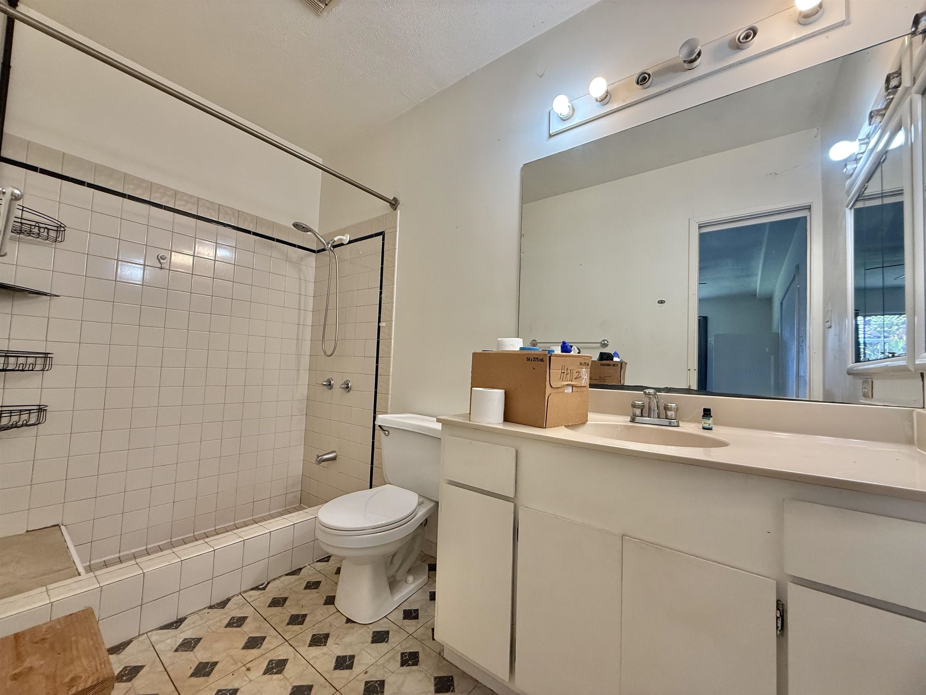 1630 Kauhikoa Road Haiku, HI 96708 - Photo 41 of 48 a bathroom with a sink a toilet and shower