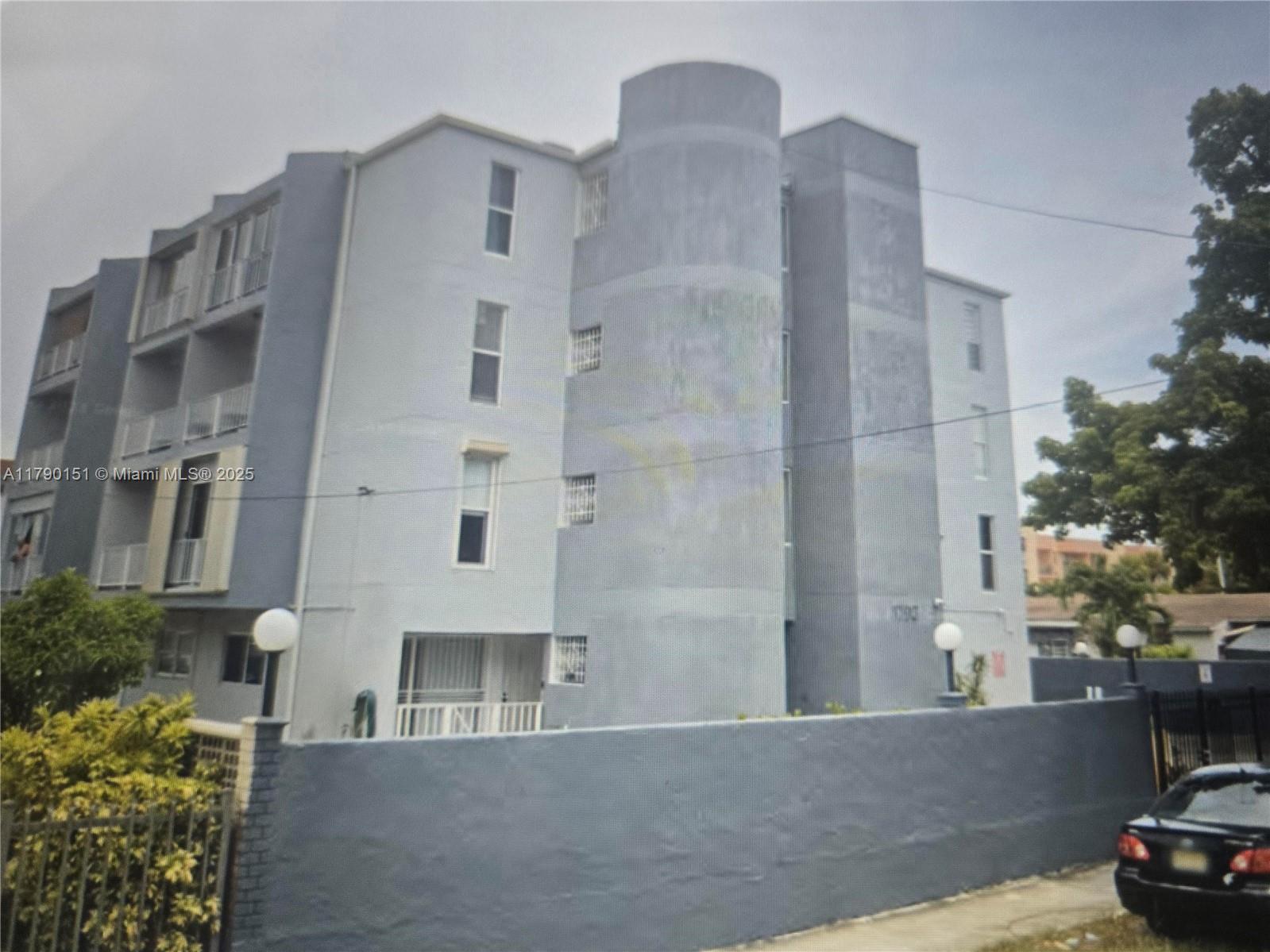 1793 Southwest 5th Street, Unit 401 Miami, FL 33135 - Photo 11 of 12 a front view of a house with parking