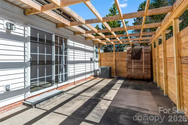 a view of a garage with wooden floor