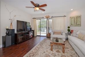 896 Davis Road League City, TX 77573 - Photo 18 of 46 a living room with furniture and a flat screen tv