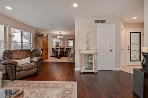 896 Davis Road League City, TX 77573 - Photo 21 of 46 a living room with furniture a fireplace and a flat screen tv