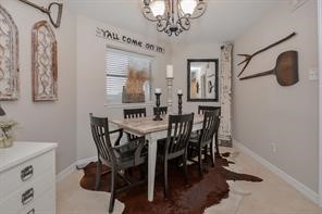 896 Davis Road League City, TX 77573 - Photo 23 of 46 a view of a dining room with furniture and chandelier