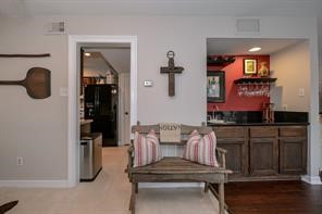 896 Davis Road League City, TX 77573 - Photo 25 of 46 a hallway with a bench and cabinets