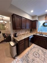 896 Davis Road League City, TX 77573 - Photo 26 of 46 a kitchen with a stove top oven a sink and a microwave