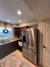 896 Davis Road League City, TX 77573 - Photo 27 of 46 a kitchen with stainless steel appliances granite countertop a refrigerator and a sink