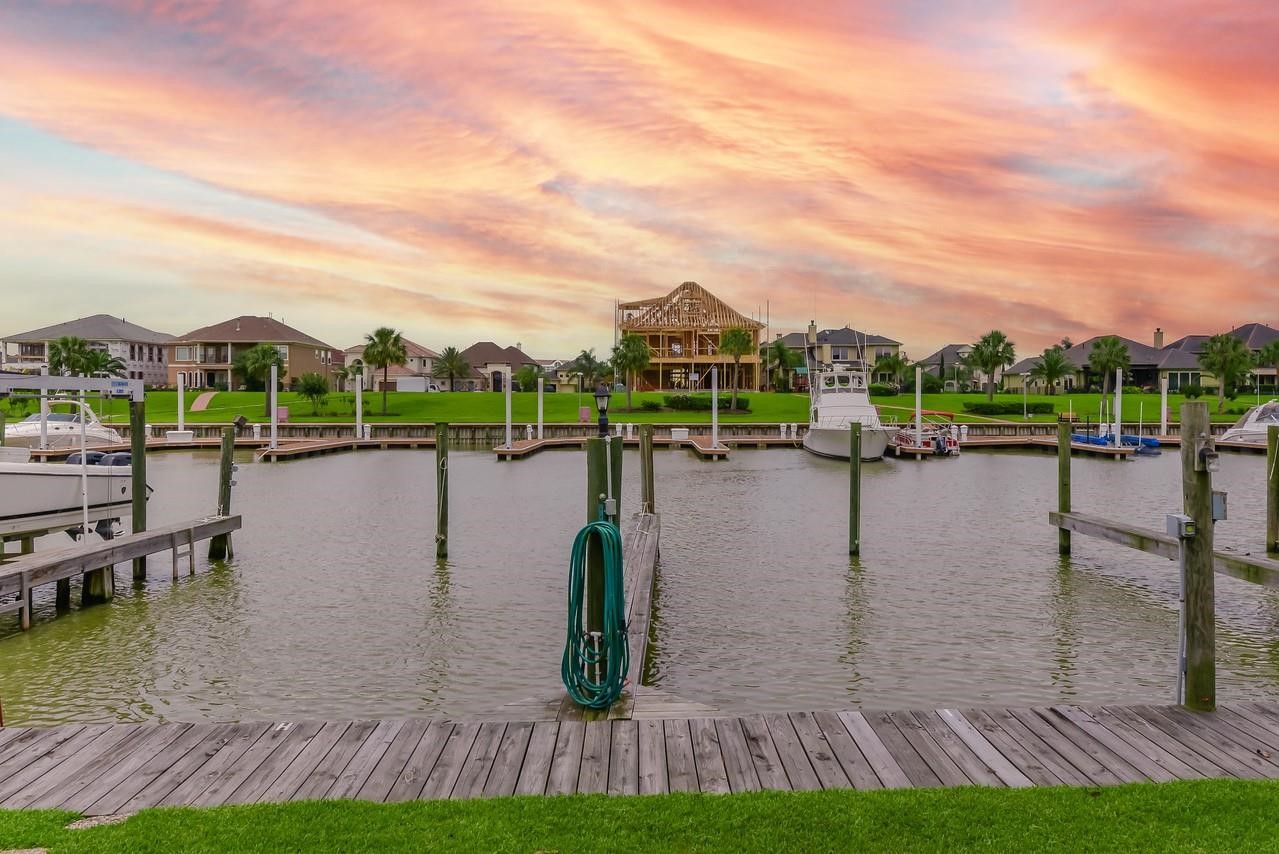 896 Davis Road League City, TX 77573 - Photo 3 of 46 a view of a lake with houses in the back