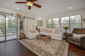 896 Davis Road League City, TX 77573 - Photo 31 of 46 a living room with furniture and a large window with wooden floor