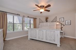 896 Davis Road League City, TX 77573 - Photo 34 of 46 a spacious bedroom with a large bed and a chandelier