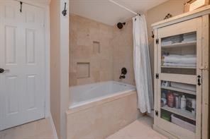 896 Davis Road League City, TX 77573 - Photo 36 of 46 a bathroom with a bathtub and a shower