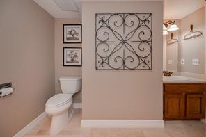 896 Davis Road League City, TX 77573 - Photo 37 of 46 a white toilet sitting next to a bathroom sink