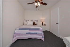 896 Davis Road League City, TX 77573 - Photo 43 of 46 a bedroom with a bed and a chandelier